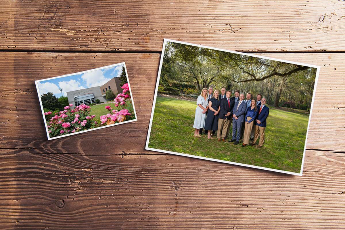 Printed photographs of the Charleston Oncology building exterior and its provider team outdoors