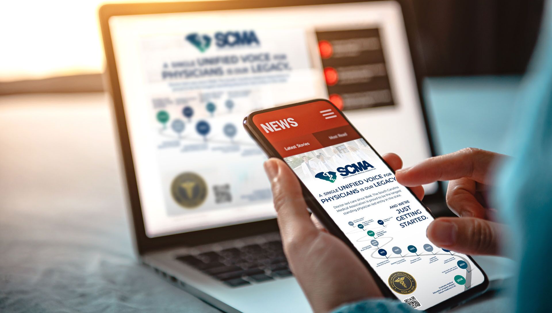 SCMA digital advertising shown on a laptop and smartphone