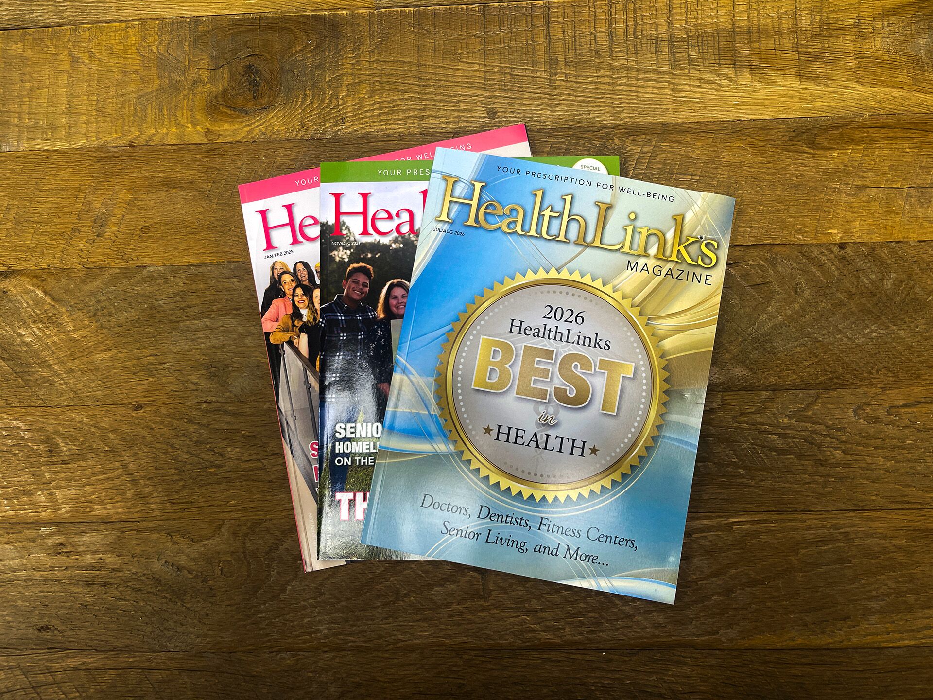 Stack of HealthLinks Magazine issues topped by the 2026 Best in Health awards edition